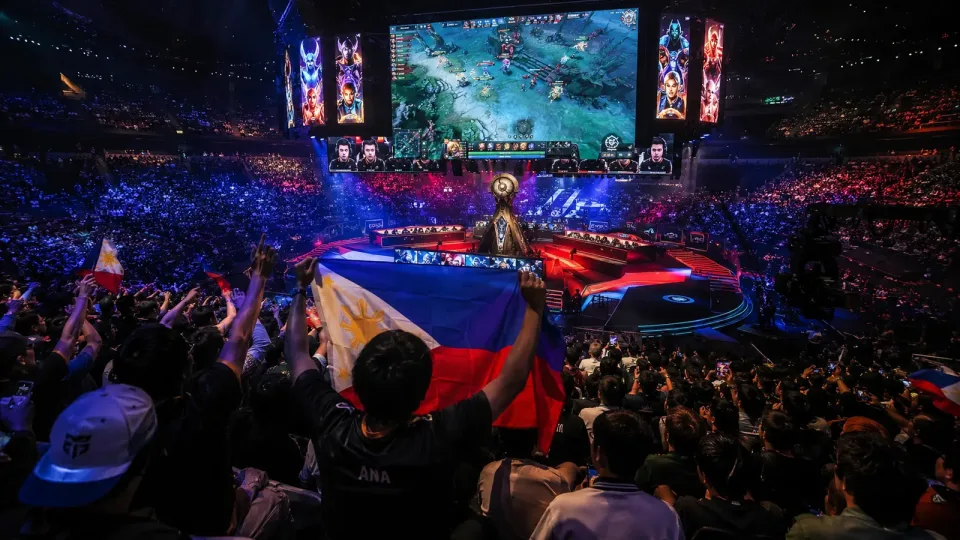 Filipino fans wave the flag in the crowd at TI 2026 in Shanghai.
